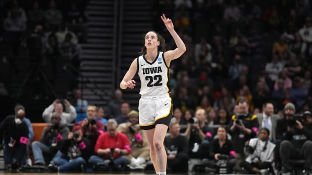 Iowa Hawkeyes guard Caitlin Clark reacts during a game.